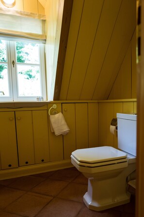 Separate bathtub and shower, hair dryer, towels