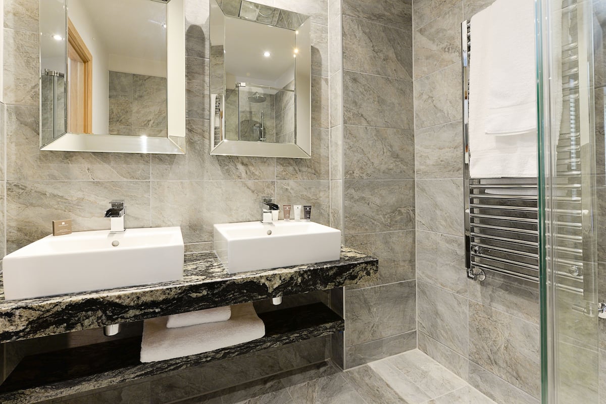 deluxe double room | bathroom | shower, designer toiletries, hair dryer, towels