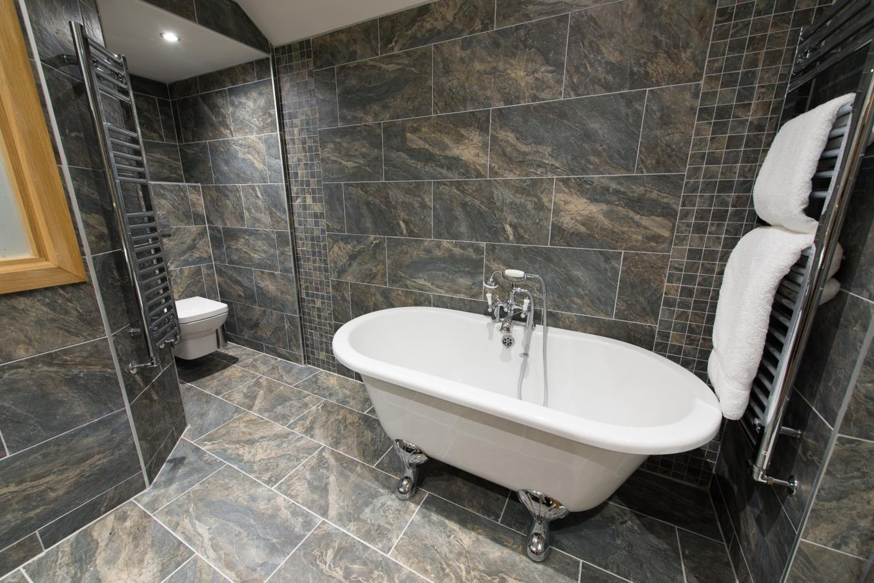 shower, designer toiletries, hair dryer, towels