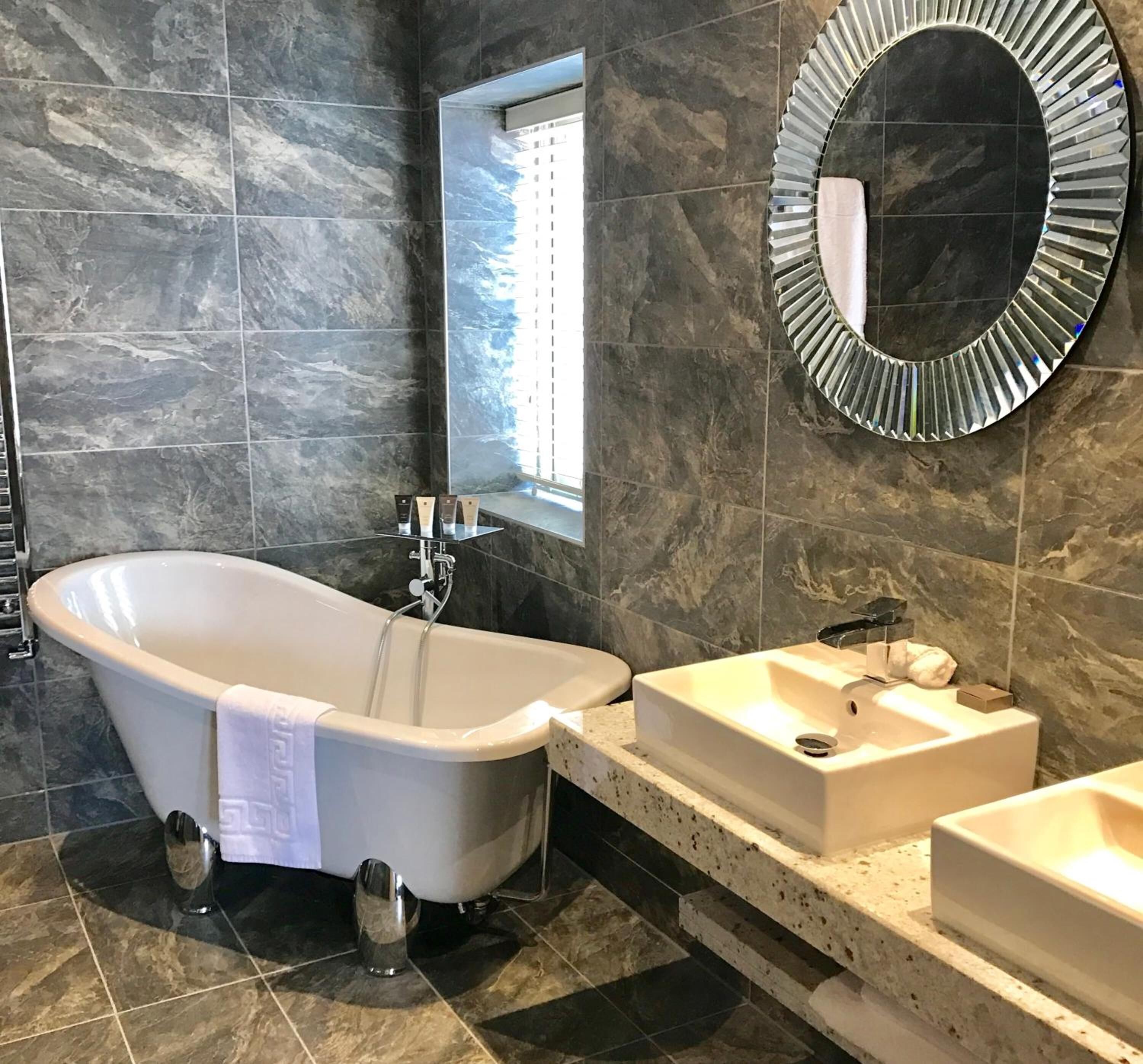 junior suite | bathroom | shower, designer toiletries, hair dryer, towels
