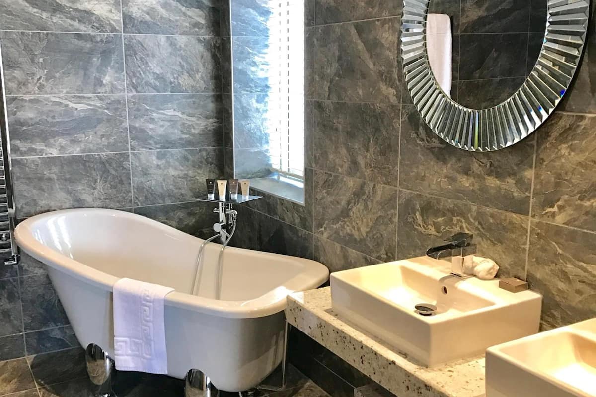 junior suite | bathroom | shower, designer toiletries, hair dryer, towels