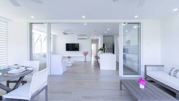 Luxury Apartment, 2 Bedrooms, Garden View | Living area | Flat-screen TV