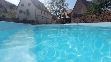 Outdoor pool, a heated pool, pool loungers