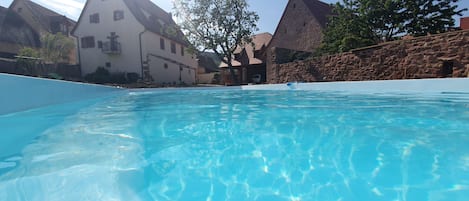 Outdoor pool, a heated pool, sun loungers