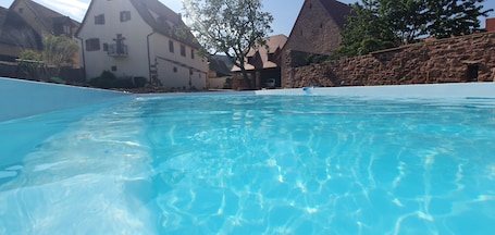 Outdoor pool, a heated pool, sun loungers