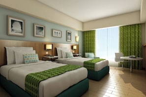 Colchones con acolchado adicional, minibar, caja fuerte y escritorio