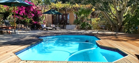 Outdoor pool, pool umbrellas, sun loungers