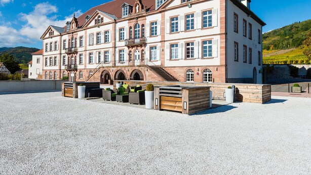 A large, historic building with multiple windows and a central staircase. - Val-vignes Haut-koenigsbourg, The Originals Relais (Saint-Hippolyte)