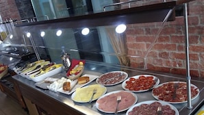 A buffet with various food items including meats, cheeses, and pastries. - Les Neus (Pas de la Casa)