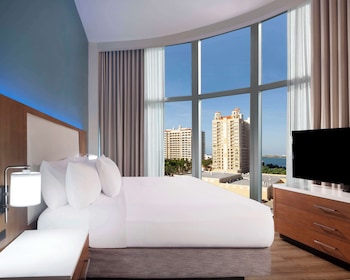 In-room safe, desk, laptop workspace, blackout drapes at Embassy Suites by Hilton Sarasota, FL