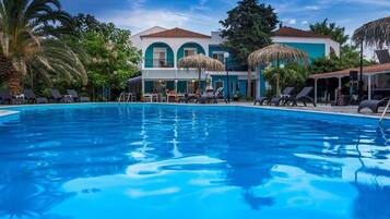 Seasonal outdoor pool, pool umbrellas, pool loungers