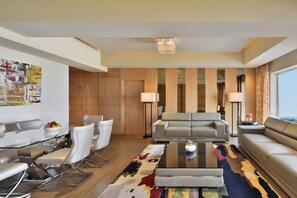 Presidential Suite, 1 King Bed | Living area | TV