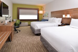 A hotel room with two beds, a desk with a chair, a TV, and a window with blinds. - Holiday Inn Express Early by IHG (Early)