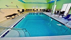 A swimming pool with a diving board, pool rules signs, and lounge chairs. - Holiday Inn Express & Suites Perryville by IHG (Perryville)
