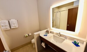A bathroom with a sink, mirror, and two towels hanging on the wall. - Holiday Inn Express & Suites Perryville by IHG (Perryville)