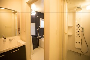 Suite Trailer | Bathroom | Hair dryer, slippers, towels - Grand Camping Palm Garden Maishima (Osaka)