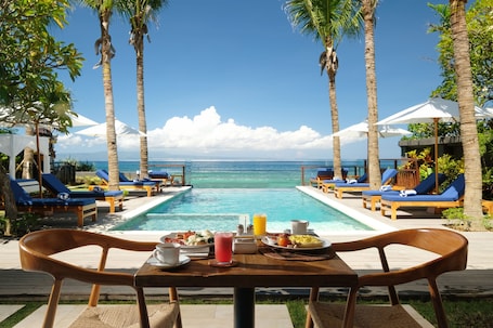 Outdoor pool, sun loungers. Sagara Candidasa by AHM