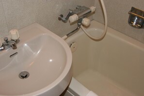 A bathroom with a sink, toilet, and bathtub. - Hiroshima Peace Hotel Ujina (Hiroshima)