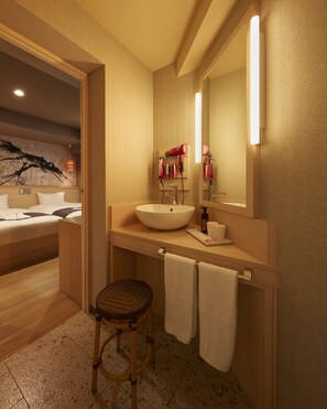 A bathroom with a sink, mirror, and towel rack. - Sakura Sky Hotel (Tokyo)