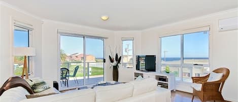 Sunset at Snapper Point | Living area | Flat-screen TV