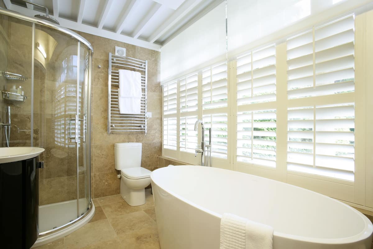 superior suite, 1 king bed | bathroom | shower, free toiletries, hair dryer, bathrobes