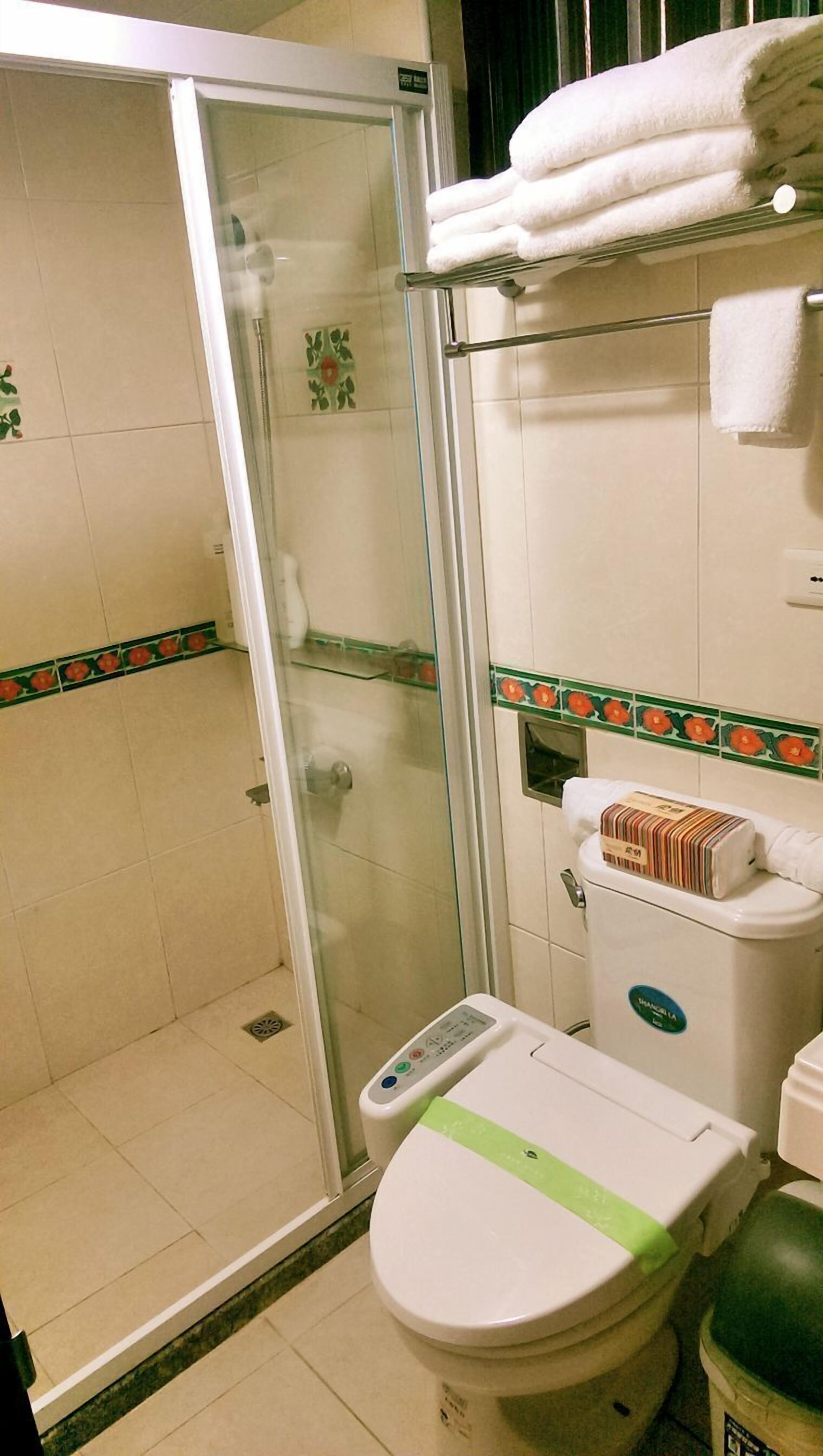 Shower, free toiletries, hair dryer, slippers