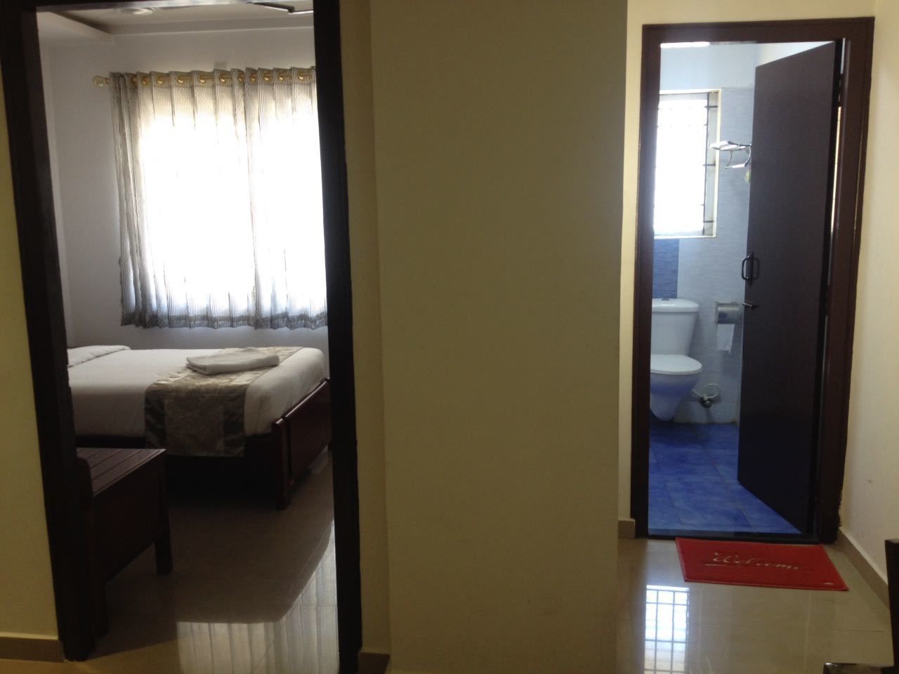 twin cot room with attached bathroom | premium bedding, in-room safe, desk, soundproofing