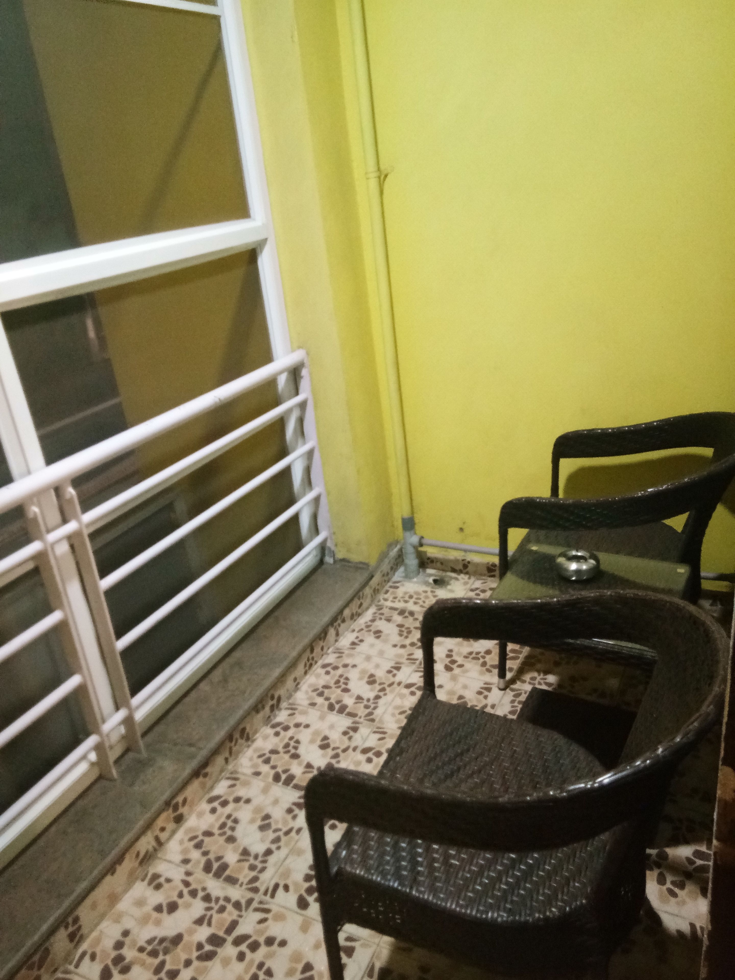 single cot room with shared bathroom | balcony