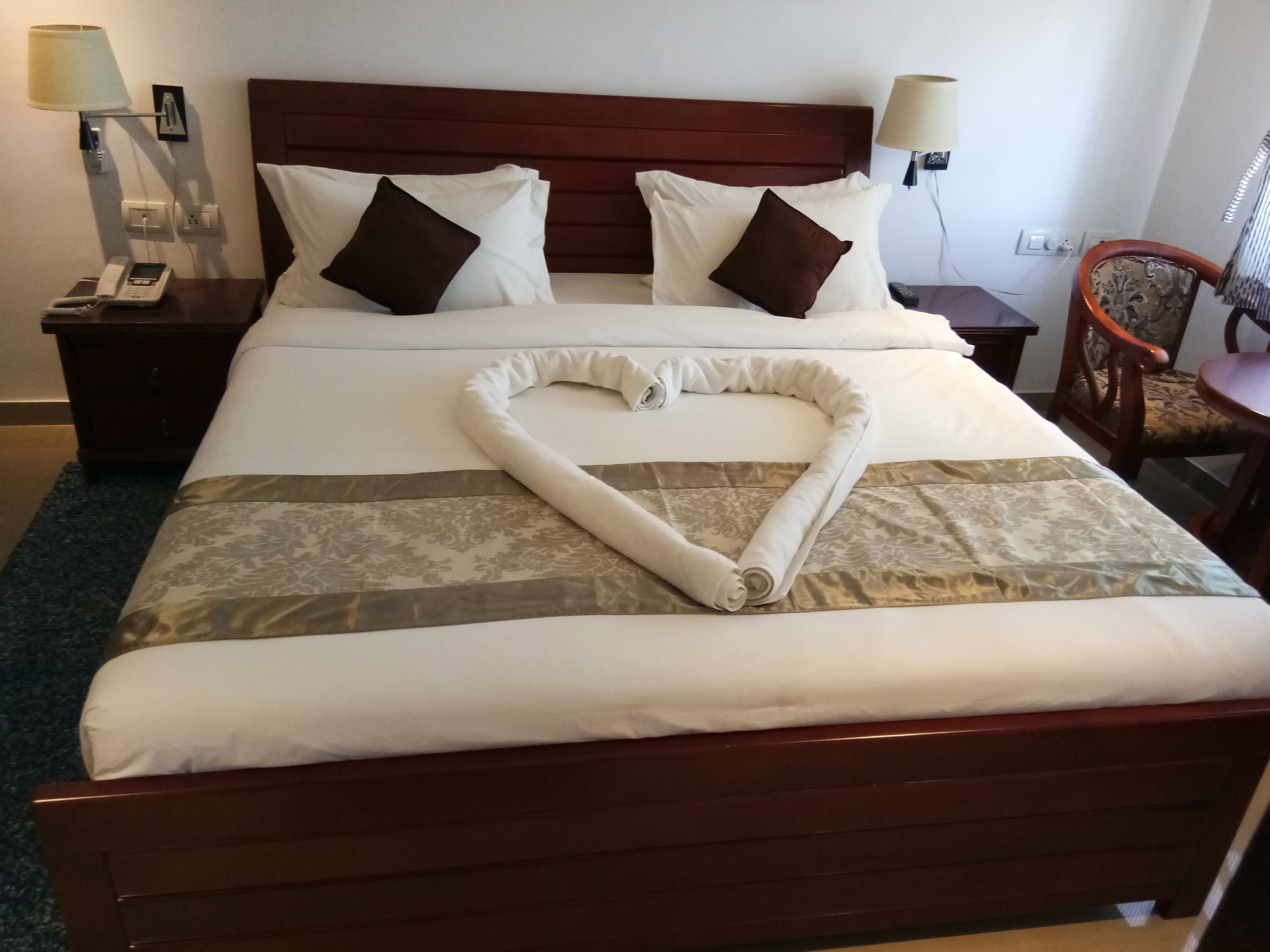 twin cot room with shared bathroom | premium bedding, in-room safe, desk, soundproofing