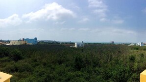 A view of a residential area with houses and a field. - MouMoon (Magong)