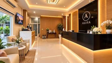 A modern reception area with a reception desk, seating area, and a large window providing a view of the outdoors.
