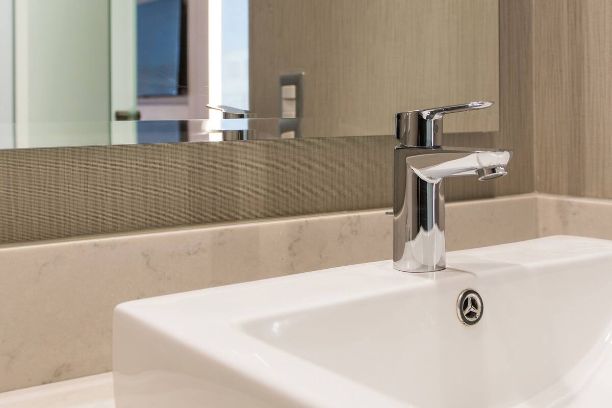 eco-friendly toiletries, hair dryer, slippers, towels