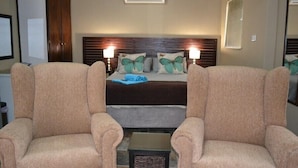 Deluxe Double Room, Garden Area | Living area | LCD TV - Pebble Fountain Guesthouse (Bloemfontein)