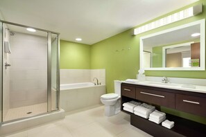 Suite, 1 Bedroom, Non Smoking | Bathroom | Combined shower/tub, free toiletries, hair dryer, towels