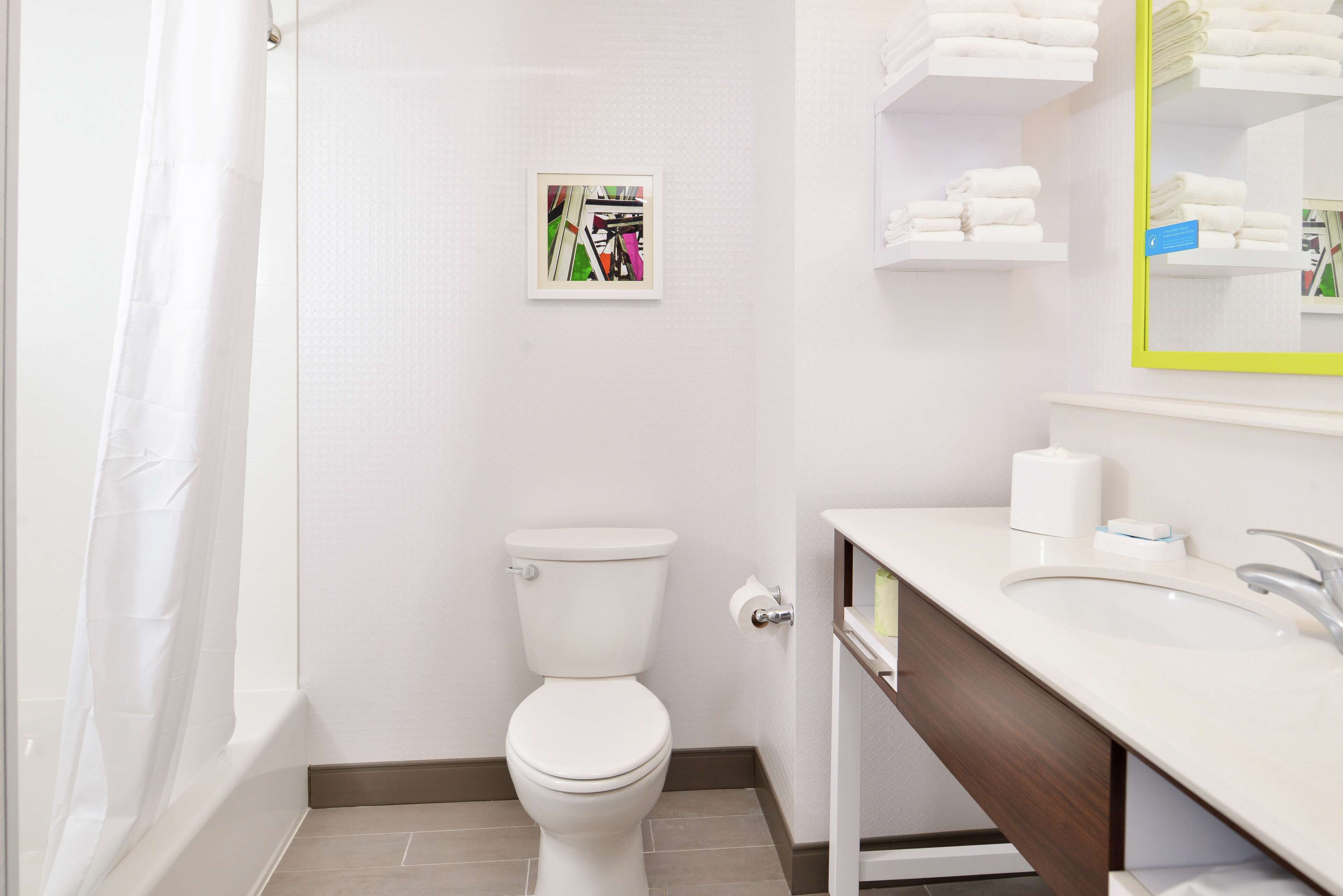 designer toiletries, hair dryer, towels