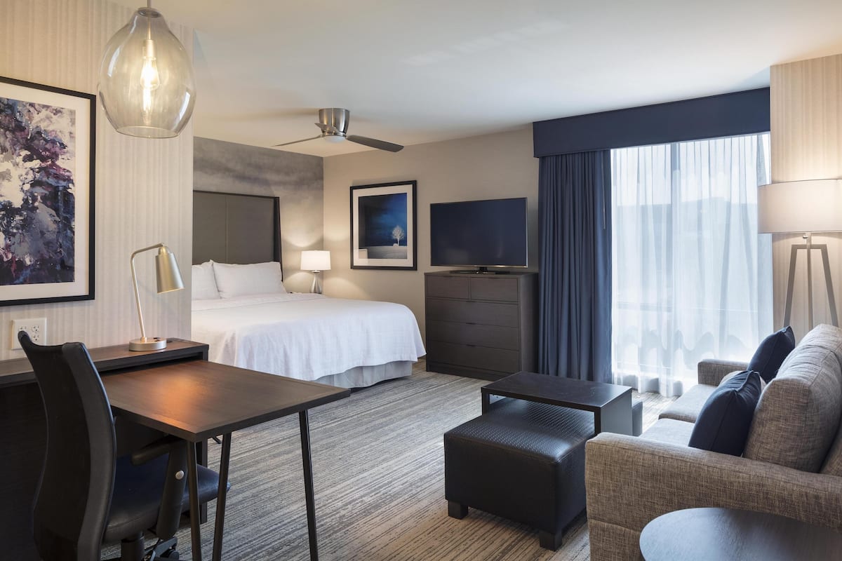 Deluxe Studio, 1 King Bed, Accessible | Living area | 42-inch flat-screen TV with cable channels, TV