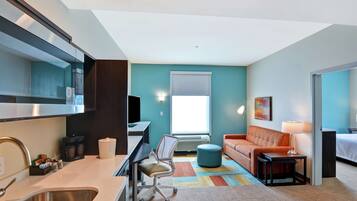 Desk, laptop workspace, blackout curtains, iron/ironing board