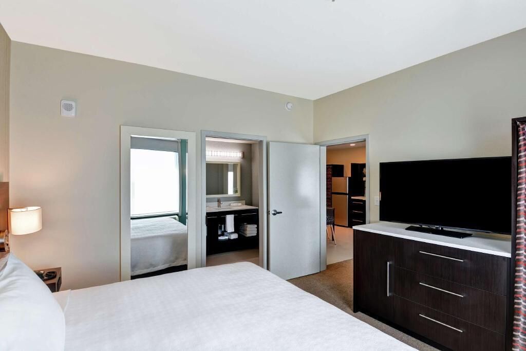 Desk, laptop workspace, blackout drapes, iron/ironing board