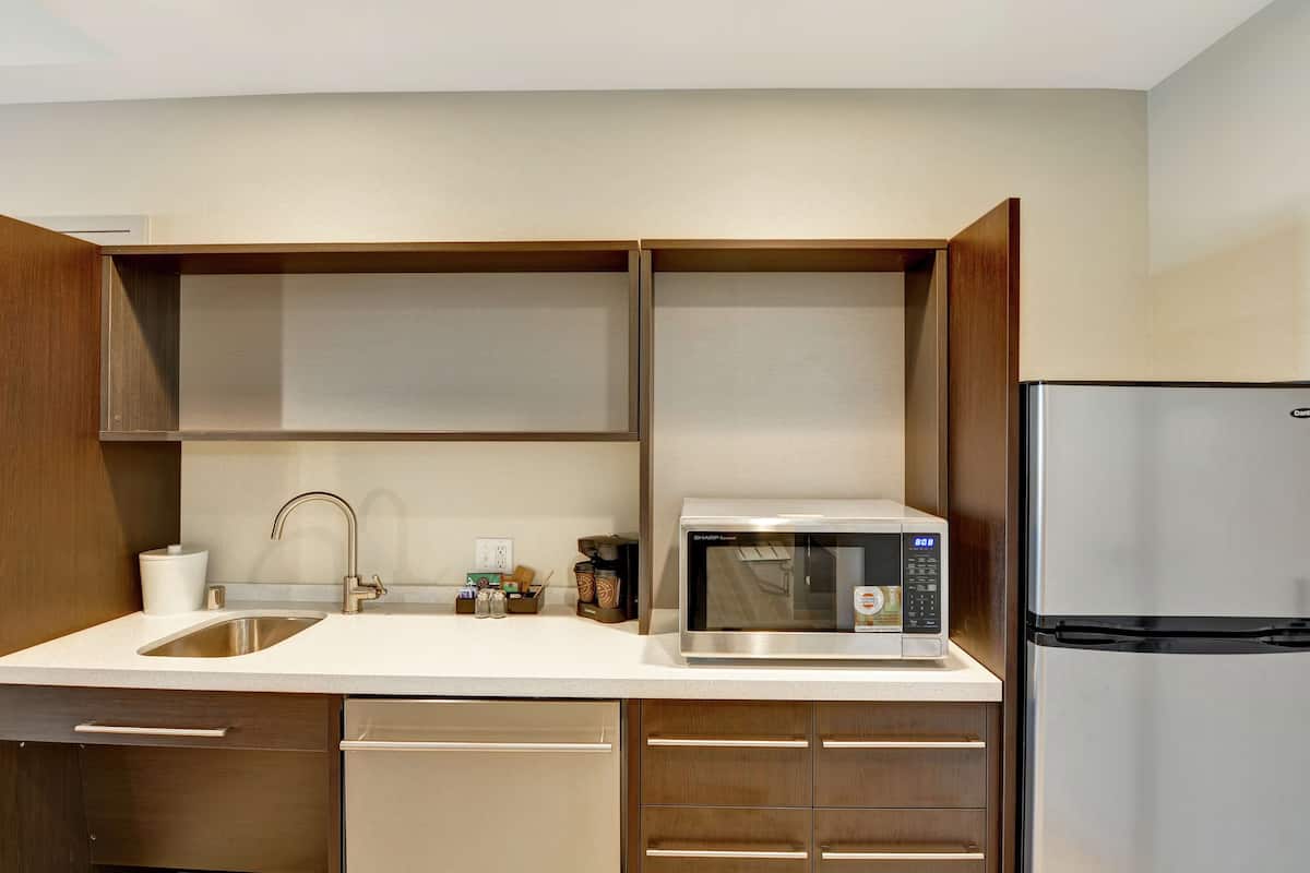 full-sized fridge, microwave, dishwasher, coffee/tea maker