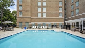 Seasonal outdoor pool, open 9:00 AM to 10:00 PM, pool umbrellas