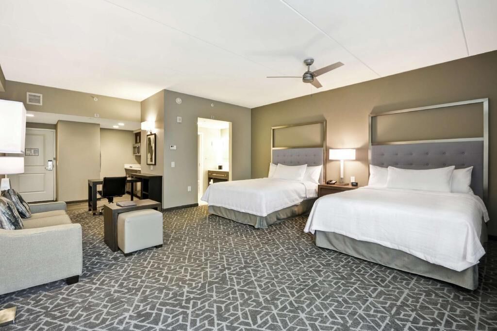 Hypo-allergenic bedding, desk, laptop workspace, blackout curtains