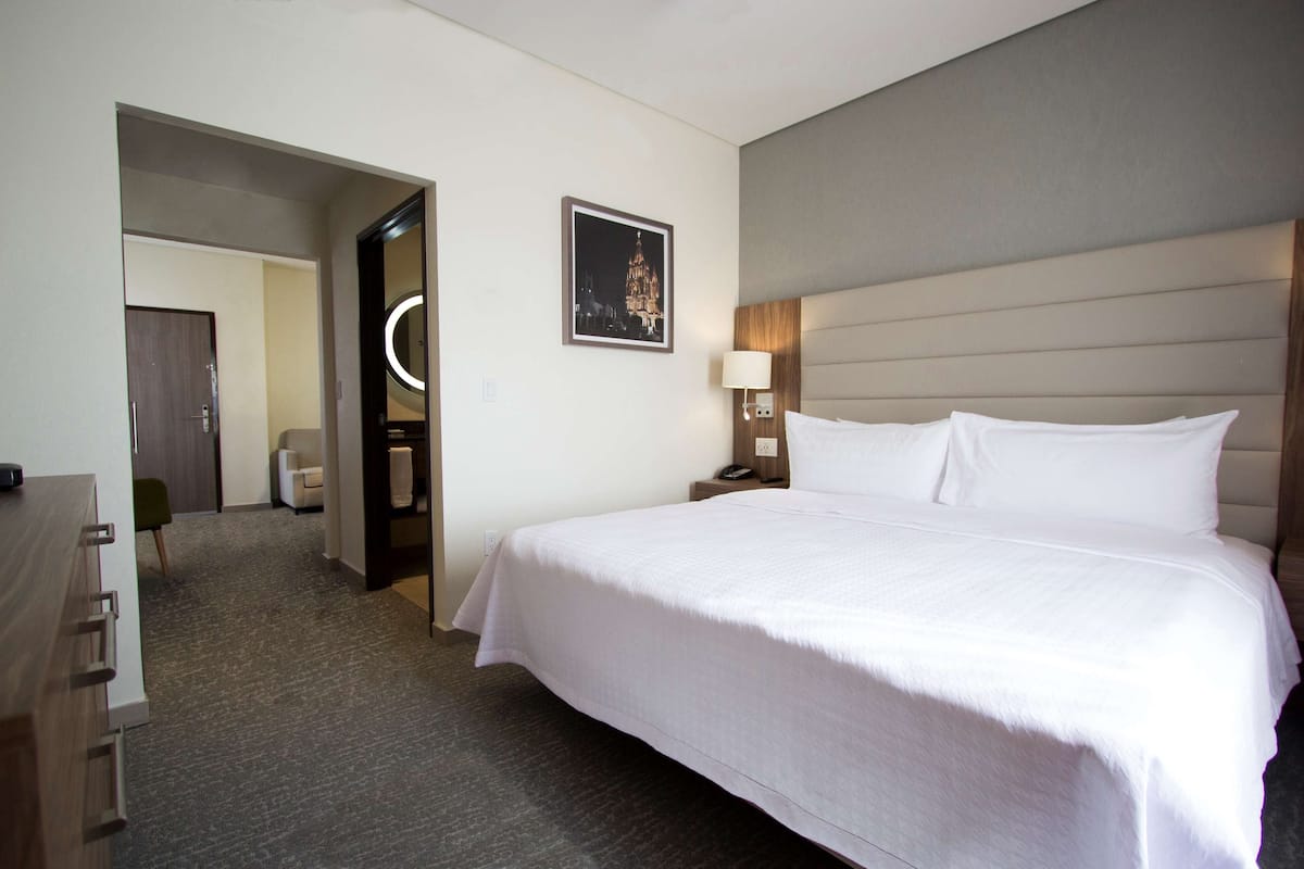 Suite, 1 King Bed | In-room safe, desk, blackout drapes, soundproofing