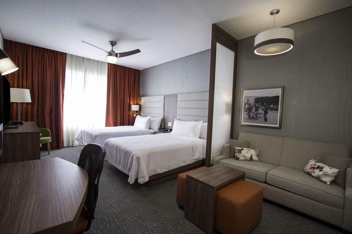 Suite, 2 Double Beds | In-room safe, desk, blackout drapes, soundproofing