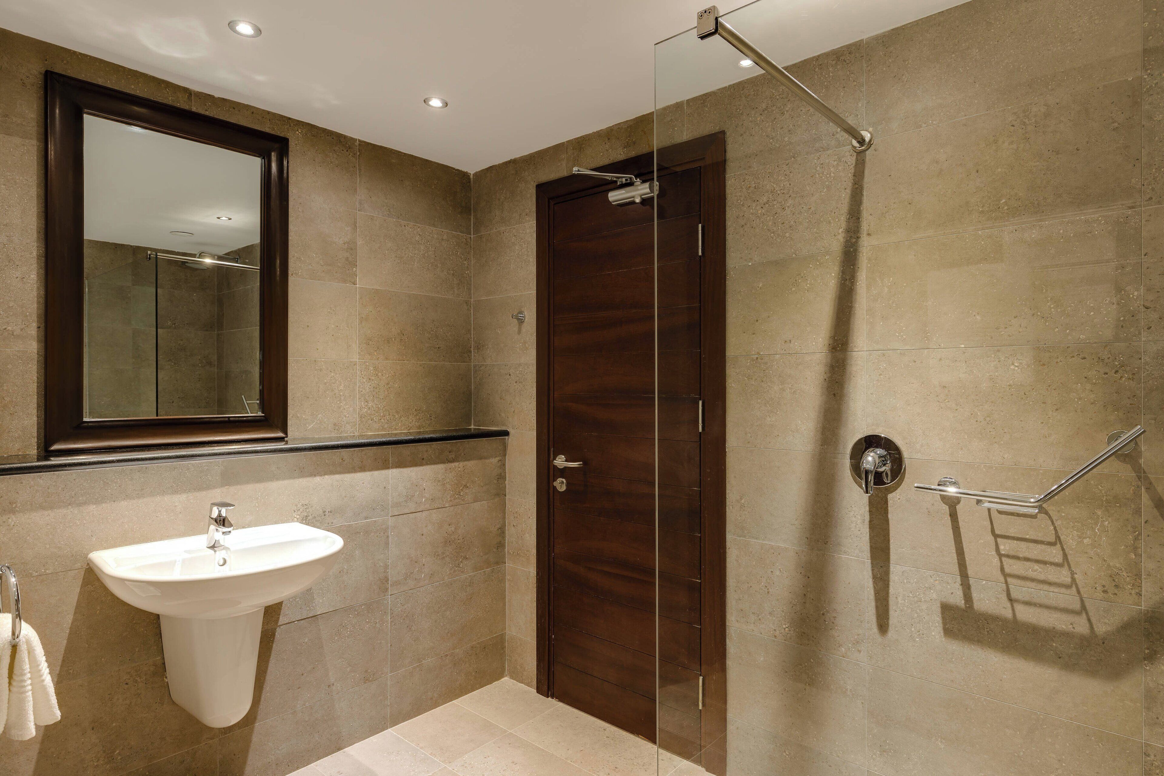 junior suite, 1 bedroom, non smoking, pool view | bathroom | separate bathtub and shower, rainfall showerhead, hair dryer, towels