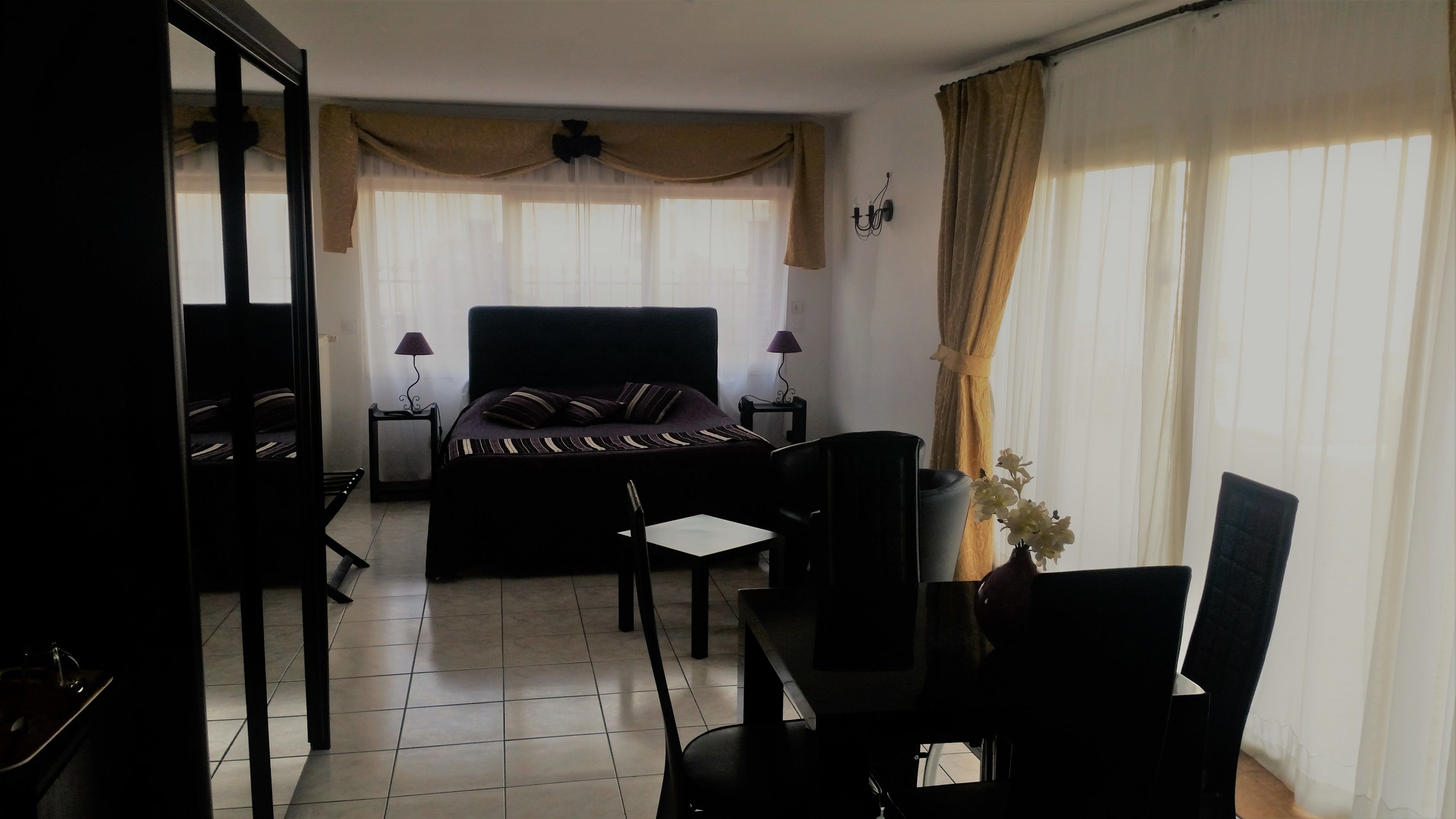 quadruple room, accessible | living area | flat-screen tv