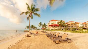 On the beach, sun loungers, beach towels