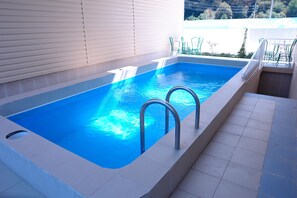 2 outdoor pools, open 7:00 AM to 11:00 PM, pool umbrellas, pool loungers