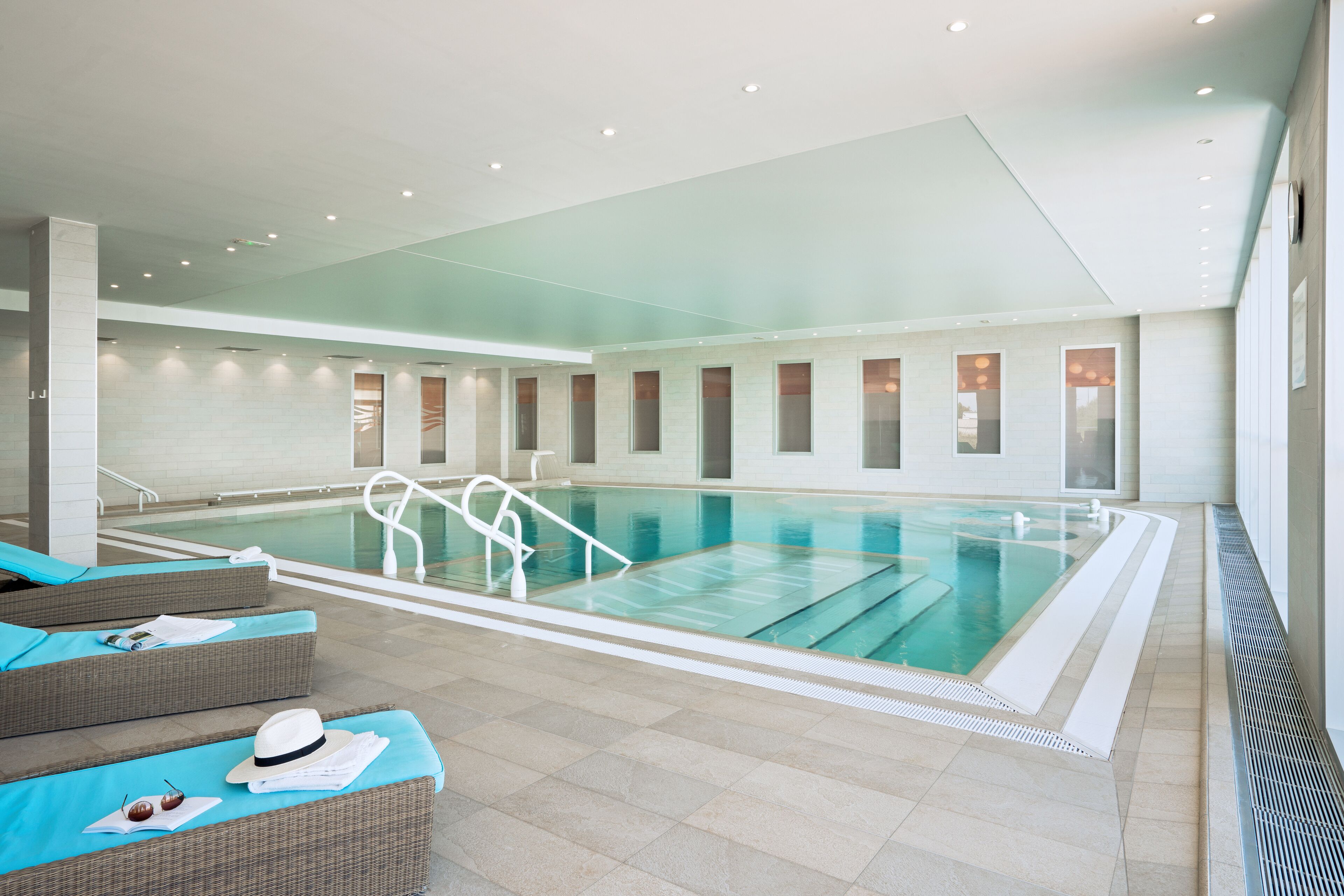 Indoor pool, open 9:30 AM to 9:30 PM, pool loungers