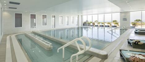 Indoor pool, open 9:30 AM to 9:00 PM, pool loungers