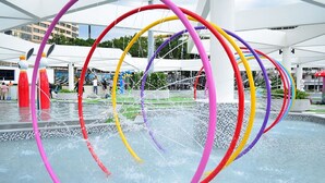 A water feature with multiple colorful rings in a public space. - Ambassador City Jomtien Pattaya - Garden Wing (Sattahip)